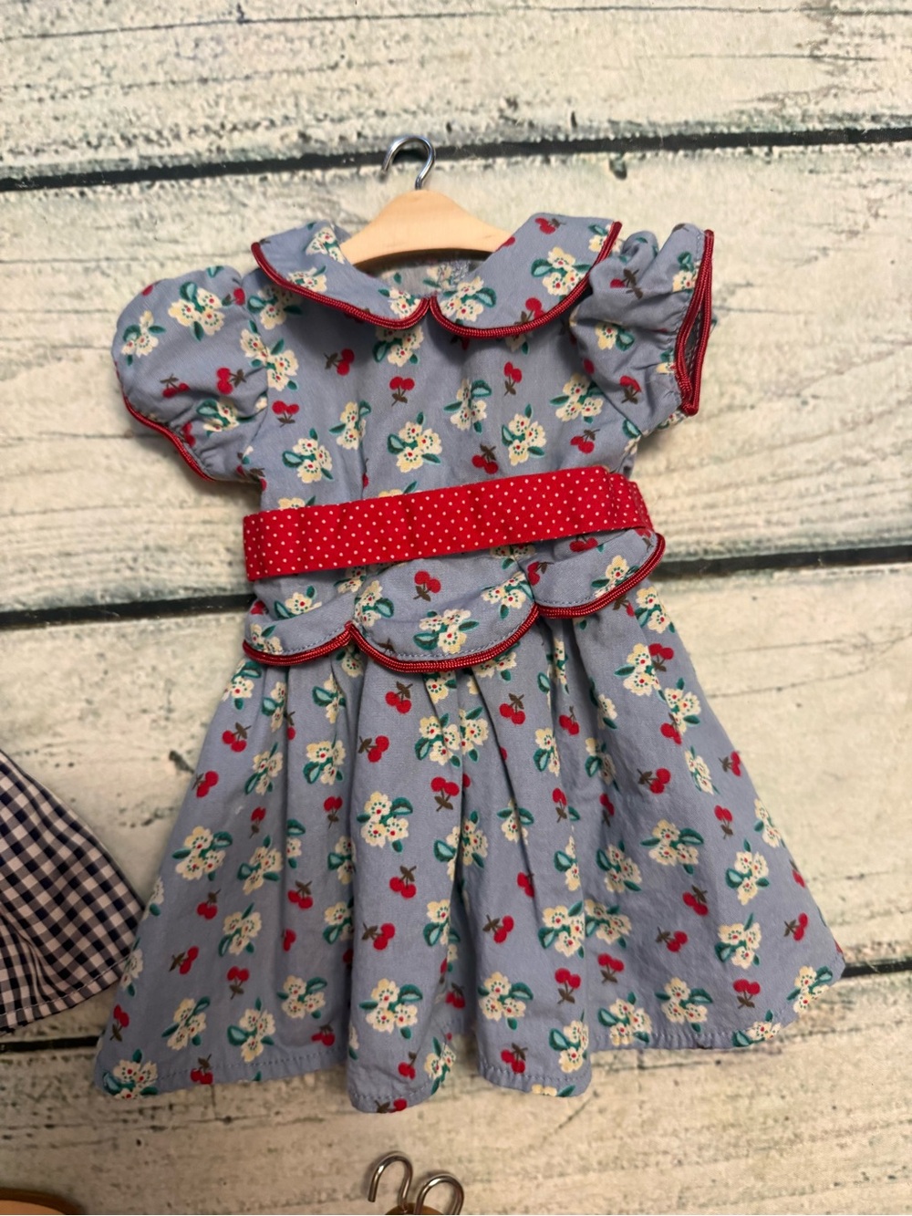 2 American girl doll dresses and 10 wood doll hangers. - Picture 3 of 10